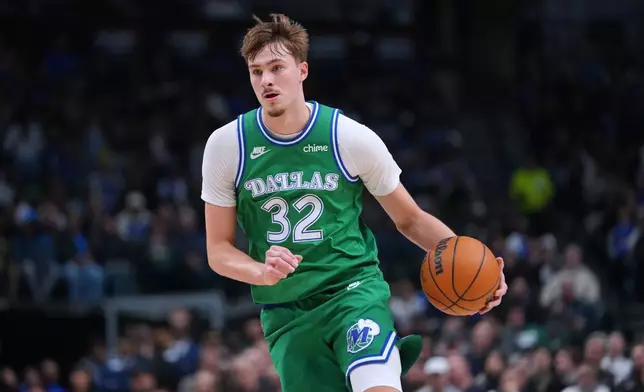 Dallas Mavericks forward Cooper Flagg drives to the basket against the Brooklyn Nets during the first half of an NBA basketball game Monday, Jan. 12, 2026, in Dallas. (AP Photo/Julio Cortez)