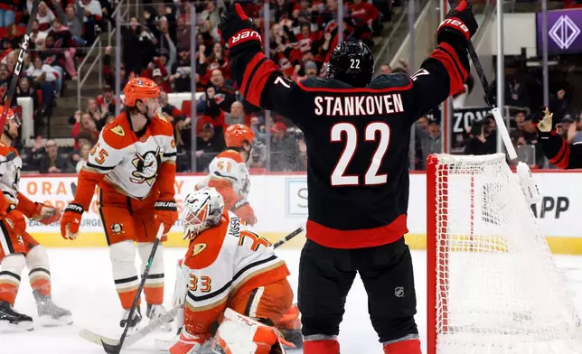 Carolina Hurricanes' Logan Stankoven (22) celebrates his goal against the Anaheim Ducks during the second period of an NHL hockey game in Raleigh, N.C., Thursday, Jan. 8, 2026. (AP Photo/Karl DeBlaker)