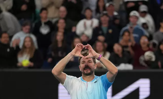 Stan Wawrinka of Switzerland celebrates after defeating Arthur Gea of France in their second round match at the Australian Open tennis championship in Melbourne, Australia, Thursday, Jan. 22, 2026. (AP Photo/Asanka Brendon Ratnayake)