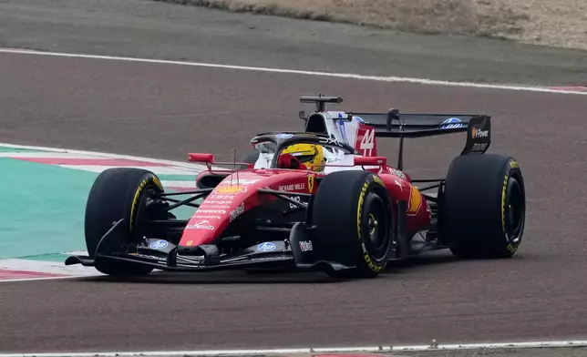 Britain's Lewis Hamilton steers his Ferrari Formula One SF-26 at the Ferrari private test track, in Fiorano Modenese, Italy, Friday, Jan. 23, 2026. (AP Photo/Antonio Calanni)