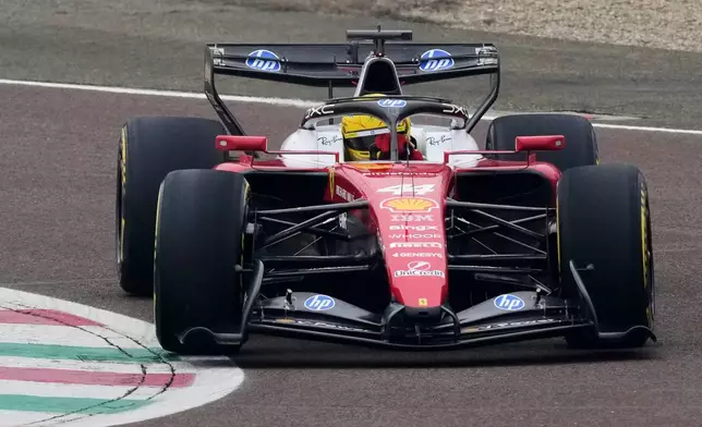 Britain's Lewis Hamilton steers his Ferrari Formula One SF-26 at the Ferrari private test track, in Fiorano Modenese, Italy, Friday, Jan. 23, 2026. (AP Photo/Antonio Calanni)
