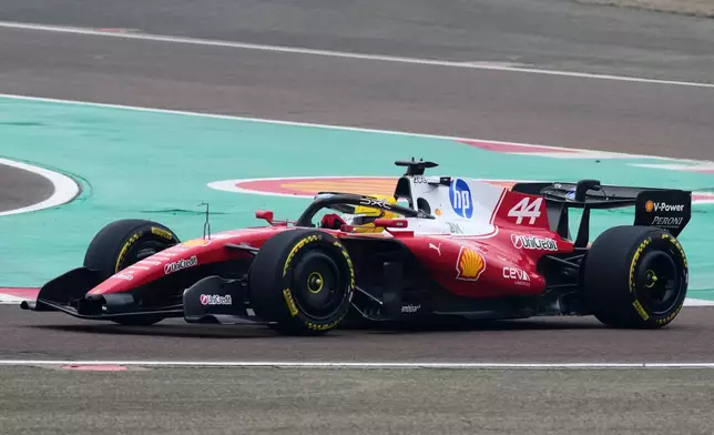 Britain's Lewis Hamilton steers his Ferrari Formula One SF-26 at the Ferrari private test track, in Fiorano Modenese, Italy, Friday, Jan. 23, 2026. (AP Photo/Antonio Calanni)