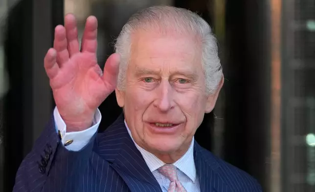 FILE -Britain's King Charles III waves as he arrives for a visit to University College Hospital Macmillan Cancer Centre in London, Tuesday, April 30, 2024. (AP Photo/Kin Cheung, File)