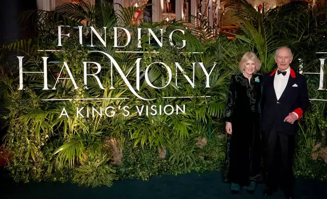 Britain's King Charles III and Queen Camilla attend the premiere of Finding Harmony: A King's Vision, at Windsor Castle in Berkshire, England, Wednesday, Jan. 28, 2026. (Aaron Chown/PA via AP)