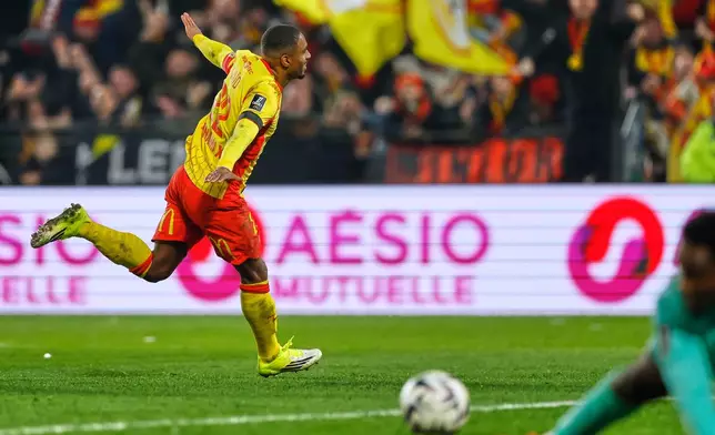 Lens' Wesley Said celebrates after scoring his side's opening goal during the French League One soccer match between Lens and Auxerre in Lens, France, Saturday, Jan. 17, 2026. (AP Photo/Jean-Francois Badias)