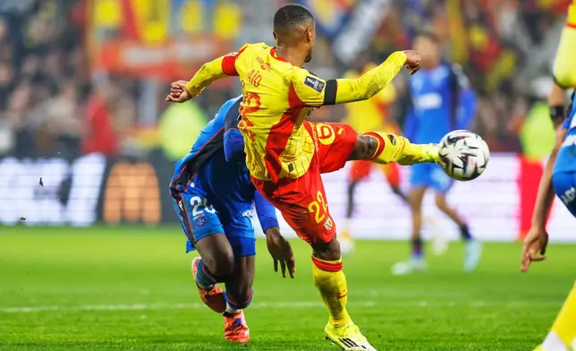 Lens' Wesley Said scores his side's opening goal during the French League One soccer match between Lens and Auxerre in Lens, France, Saturday, Jan. 17, 2026. (AP Photo/Jean-Francois Badias)