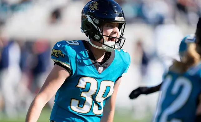 Jacksonville Jaguars place-kicker Cam Little (39) celebrates his 67-yard field goal during the first half of an NFL football game against the Tennessee Titans, Sunday, Jan. 4, 2026, in Jacksonville, Fla. (AP Photo/John Raoux)