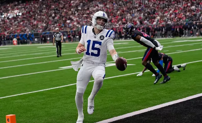 Indianapolis Colts quarterback Riley Leonard (15) runs for a touchdown against the Houston Texans during the second half of an NFL football game in Houston, Sunday, Jan. 4, 2026. (AP Photo/David J. Phillip)