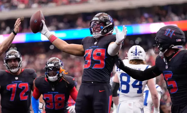 Houston Texans linebacker Henry To'oto'o (39) celebrates his fumble recovery against the Indianapolis Colts during the first half of an NFL football game in Houston, Sunday, Jan. 4, 2026. (AP Photo/Ashley Landis)