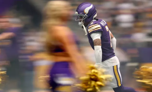 Minnesota Vikings cornerback Byron Murphy Jr. runs onto the field before an NFL football game against the Green Bay Packers, Sunday, Jan. 4, 2026, in Minneapolis. (AP Photo/Ellen Schmidt)