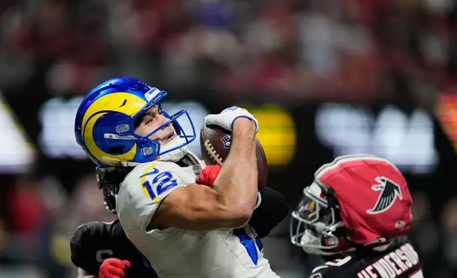 Los Angeles Rams wide receiver Puka Nacua (12) pulls in a touchdown pass that was called back on a penalty in the second half of an NFL football game against the Atlanta Falcons, Monday, Dec. 29, 2025, in Atlanta. (AP Photo/Brynn Anderson)