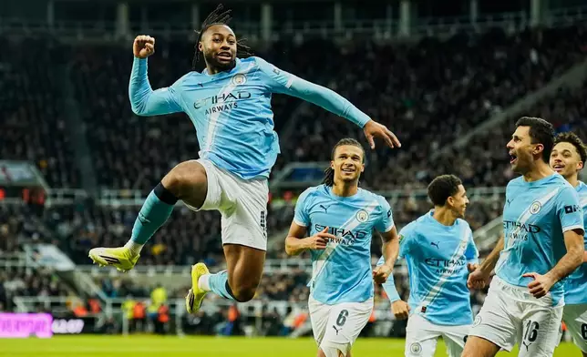 Manchester City's Antoine Semenyo, left, celebrates a goal that was later disallowed by a VAR decision during the English League Cup semifinal first leg soccer match between Newcastle and Manchester City in Newcastle, England, Tuesday, Jan. 13, 2026. (AP Photo/Dave Thompson)