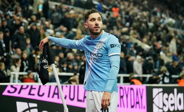 Manchester City's Rayan Cherki celebrates after scoring his side's second goal during the English League Cup semifinal first leg soccer match between Newcastle and Manchester City in Newcastle, England, Tuesday, Jan. 13, 2026. (AP Photo/Dave Thompson)