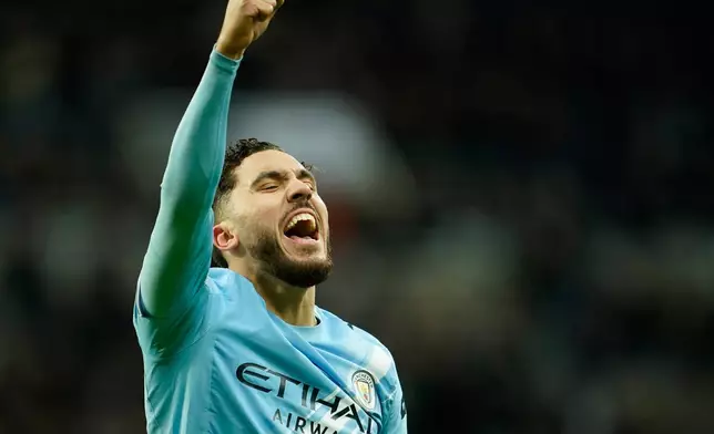 Manchester City's Rayan Cherki celebrates after scoring his side's second goal during the English League Cup semifinal first leg soccer match between Newcastle and Manchester City in Newcastle, England, Tuesday, Jan. 13, 2026. (AP Photo/Dave Thompson)