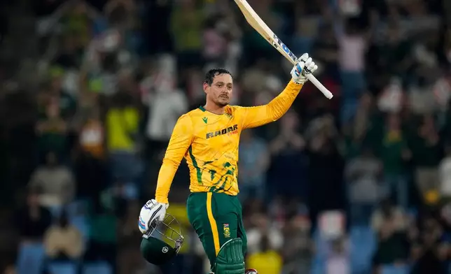 South Africa's batsman Quinton de Kock raises his bat after reaching a century during the T20 International cricket match between South Africa and West Indies, in Centurion, South Africa, Thursday, Jan. 29, 2026. (AP Photo/Themba Hadebe)