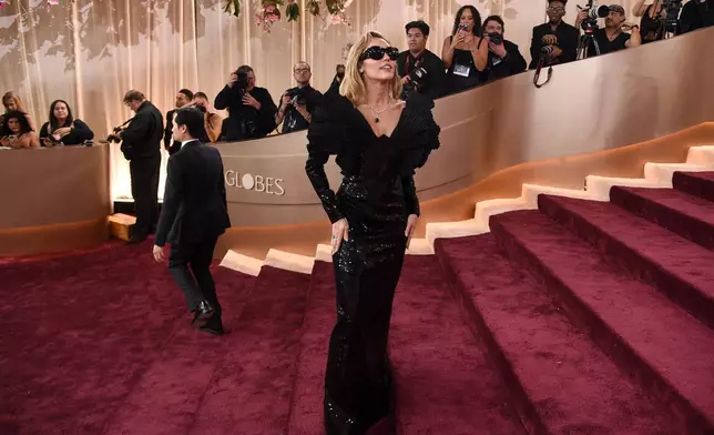Miley Cyrus arrives at the 83rd Golden Globes on Sunday, Jan. 11, 2026, at the Beverly Hilton in Beverly Hills, Calif. (Photo by Richard Shotwell/Invision/AP)