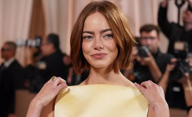 Emma Stone arrives at the 83rd Golden Globes on Sunday, Jan. 11, 2026, at the Beverly Hilton in Beverly Hills, Calif. (Photo by Jordan Strauss/Invision/AP)