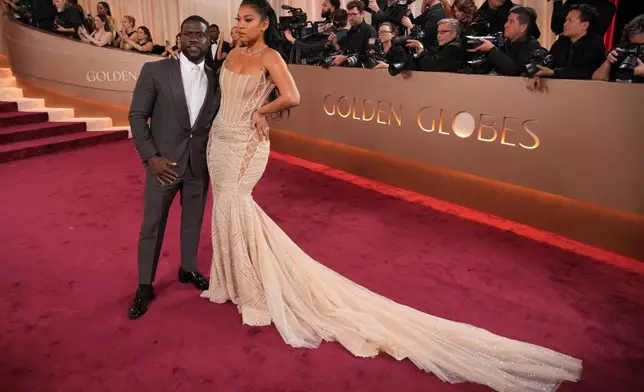 Kevin Hart, left, and Eniko Hart arrive at the 83rd Golden Globes on Sunday, Jan. 11, 2026, at the Beverly Hilton in Beverly Hills, Calif. (Photo by Jordan Strauss/Invision/AP)