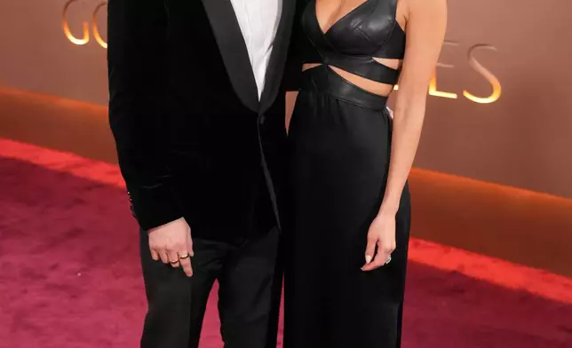 Macaulay Culkin, left, and Brenda Song arrive at the 83rd Golden Globes on Sunday, Jan. 11, 2026, at the Beverly Hilton in Beverly Hills, Calif. (Photo by Jordan Strauss/Invision/AP)