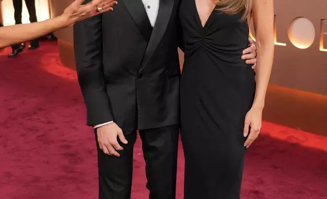 Dave Franco, left, and Alison Brie arrive at the 83rd Golden Globes on Sunday, Jan. 11, 2026, at the Beverly Hilton in Beverly Hills, Calif. (Photo by Jordan Strauss/Invision/AP)