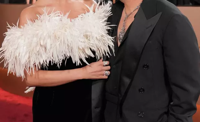 Selena Gomez, left, and Benny Blanco arrive at the 83rd Golden Globes on Sunday, Jan. 11, 2026, at the Beverly Hilton in Beverly Hills, Calif. (Photo by Jordan Strauss/Invision/AP)