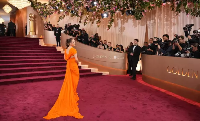 Laufey arrives at the 83rd Golden Globes on Sunday, Jan. 11, 2026, at the Beverly Hilton in Beverly Hills, Calif. (Photo by Jordan Strauss/Invision/AP)