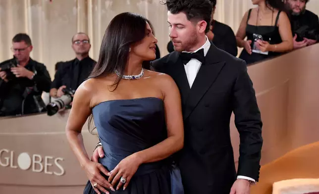 Priyanka Chopra-Jonas, left, and Nick Jonas arrive at the 83rd Golden Globes on Sunday, Jan. 11, 2026, at the Beverly Hilton in Beverly Hills, Calif. (Photo by Richard Shotwell/Invision/AP)