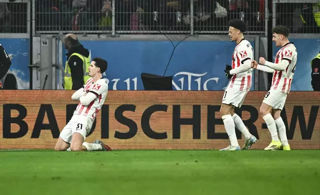 Freiburg's Igor Matanovic, left, celebrates after scoring during the German Bundesliga soccer match between SC Freiburg and 1. FC Cologne in Freiburg im Breisgau, Germany, Sunday, Jan. 25. 2026. (Silas Stein/dpa via AP)
