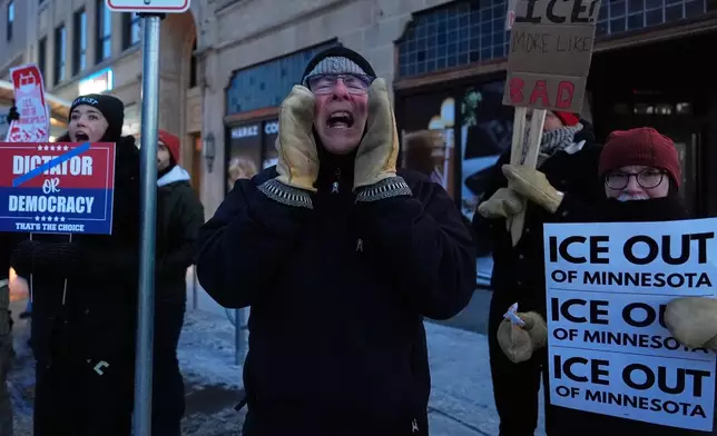 A demonstrator shouts during a rally against federal immigration enforcement on Wednesday, Jan. 28, 2026, in Minneapolis. (AP Photo/Julia Demaree Nikhinson)