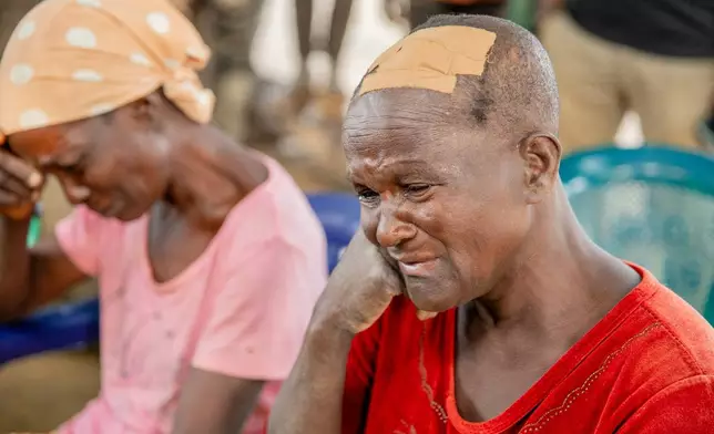 In this photo released by the Kaduna State government, people react during a meeting with Kaduna state Governor. Uba Sani, after gunmen attack in Kurmin Wali, northwest Nigeria, Wednesday, Jan. 21, 2026. (Kaduna State Government via AP)