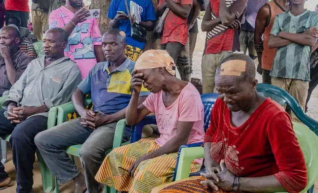 In this photo released by the Kaduna State government, people react during a meeting with Kaduna state Governor. Uba Sani, after gunmen attack in Kurmin Wali, northwest Nigeria, Wednesday, Jan. 21, 2026. (Kaduna State Government via AP)