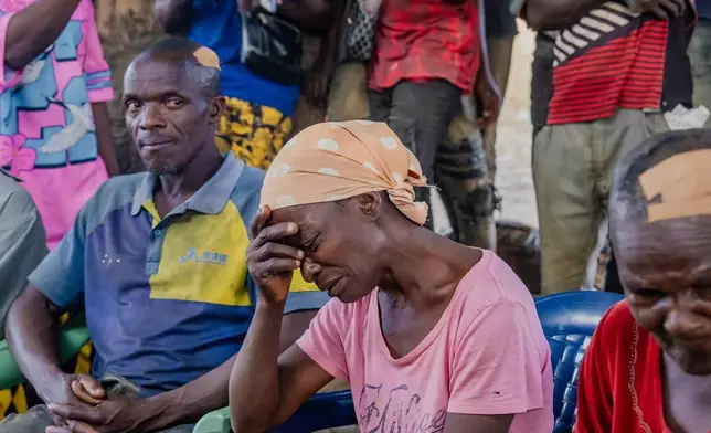 In this photo released by the Kaduna State government, people react during a meeting with Kaduna state Governor. Uba Sani, after gunmen attack in Kurmin Wali, northwest Nigeria, Wednesday, Jan. 21, 2026. (Kaduna State Government via AP)