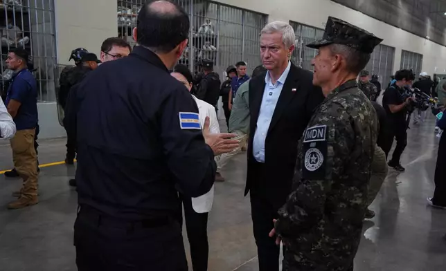 Chile's President-elect Jose Antonio Kast, center, is given a tour of the mega prison known as Detention Center Against Terrorism (CECOT) in Tecololuca, El Salvador, Friday, Jan. 30, 2026. (AP Photo/Salvador Melendez)
