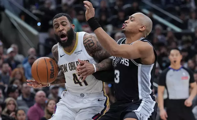 New Orleans Pelicans guard Saddiq Bey (41) drives against San Antonio Spurs forward Keldon Johnson (3) during the first half of an NBA basketball game in San Antonio, Sunday, Jan. 25, 2026. (AP Photo/Eric Gay)