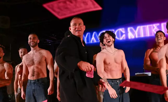 Channing Tatum throws fake money during a "Magic Mike" special announcement on Tuesday, Jan. 20, 2026, in New York. (Photo by Evan Agostini/Invision/AP)