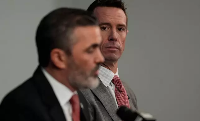 New Atlanta Falcons head coach Kevin Stefanski, left, speaks as Atlanta Falcons President of Football Matt Ryan looks on during a NFL Atlanta Falcons news conference, Tuesday, Jan. 27, 2026, in Atlanta. (AP Photo/Mike Stewart)