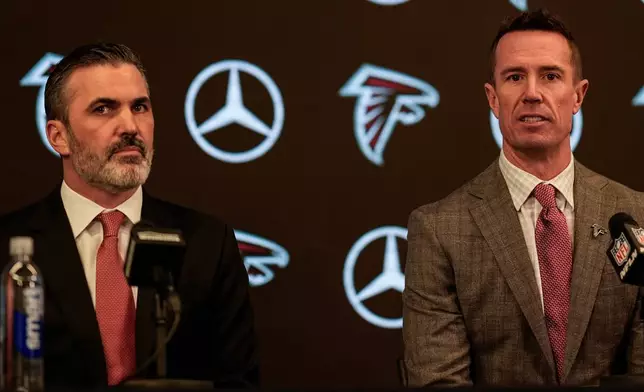 New Atlanta Falcons head coach Kevin Stefanski, left, speaks as Atlanta Falcons President of Football Matt Ryan looks on during a NFL news conference, Tuesday, Jan. 27, 2026, in Atlanta. (AP Photo/Mike Stewart)