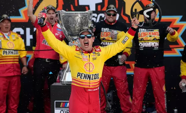 FILE - Joey Logano celebrates after winning a NASCAR Cup Series Championship auto race for the championship at Phoenix Raceway, Sunday, Nov. 10, 2024, in Avondale, Ariz. (AP Photo/John Locher, File)