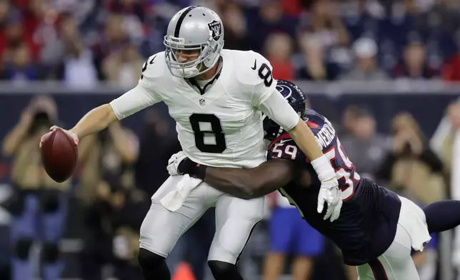 FILE - Oakland Raiders quarterback Connor Cook (8) is sacked by Houston Texans outside linebacker Whitney Mercilus (59) during the second half of an AFC Wild Card NFL football game Jan. 7, 2017, in Houston. (AP Photo/Eric Gay, File)