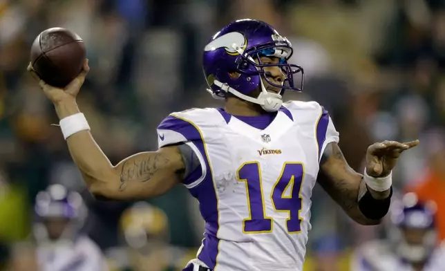 FILE - Minnesota Vikings quarterback Joe Webb (14) throws a pass during the second half of an NFL wild card playoff football game against the Green Bay Packers Jan. 5, 2013, in Green Bay, Wis. (AP Photo/Jeffrey Phelps, File)