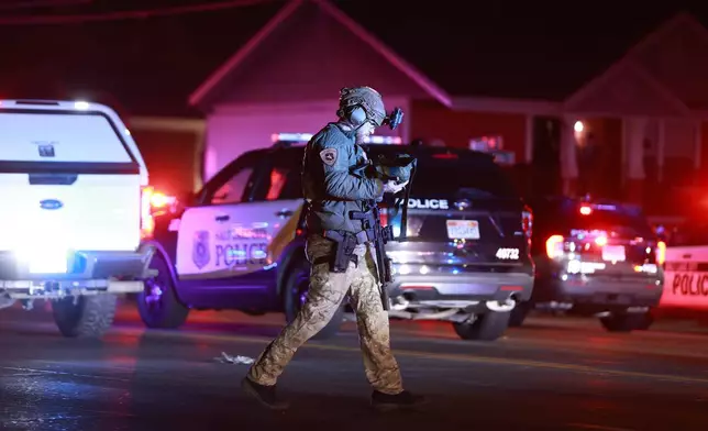 CORRECTS YEAR TO 2026 - Police respond to a fatal shooting in a parking lot of The Church of Jesus Christ of Latter-day Saints in Salt Lake City on Wednesday, Jan. 7, 2026. (Rio Giancarlo/The Deseret News via AP)