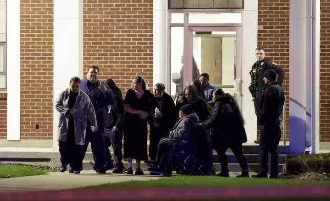 Funeral attendees leave a meetinghouse of The Church of Jesus Christ of Latter-day Saints after a fatal shooting in the parking lot in Salt Lake City on Wednesday, Jan. 7, 2025. (Laura Seitz/The Deseret News via AP)