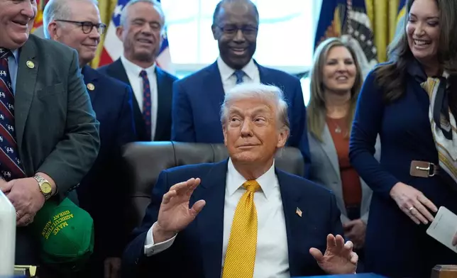 President Donald Trump speaks in the Oval Office of the White House, Wednesday, Jan. 14, 2026, in Washington. (AP Photo/Alex Brandon)