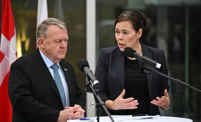 Denmark's Foreign Minister Lars Løkke Rasmussen and Greenland's Foreign Minister Vivian Motzfeldt speak at a news conference at the Embassy of Denmark, Wednesday, Jan. 14, 2026, in Washington. (AP Photo/John McDonnell)