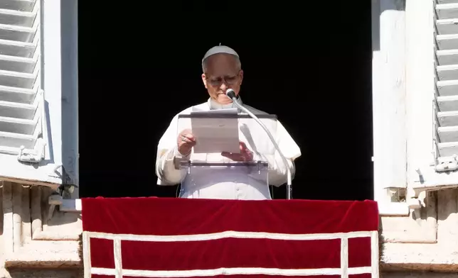 Pope Leo XIV delivers the Angelus noon prayer in St. Peter's Square at the Vatican, Sunday, Jan. 11, 2026. (AP Photo/Gregorio Borgia)