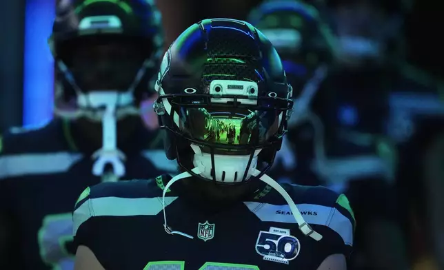 Seattle Seahawks wide receiver Cooper Kupp is seen during warm ups before an NFL football divisional playoff game against the San Francisco 49ers, Saturday, Jan. 17, 2026, in Seattle. (AP Photo/Lindsey Wasson)