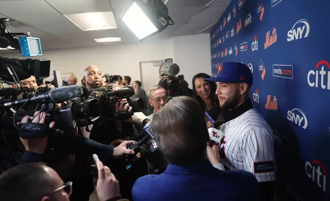 Bo Bichette speaks with members of the media during his introductory press conference with the New York Mets, Wednesday, Jan. 21, 2026, in New York. (AP Photo/Heather Khalifa)