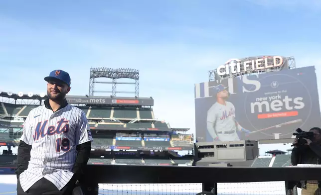 Bo Bichette poses for his photos on the field after his introductory press conference with the New York Mets, Wednesday, Jan. 21, 2026, in New York. (AP Photo/Heather Khalifa)