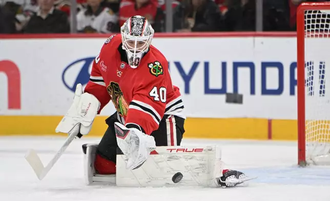 Chicago Blackhawks goalie Arvid Soderblom makes a save during the first period of an NHL hockey game against the Vegas Golden Knights, Sunday, Jan. 4, 2026, in Chicago. (AP Photo/Paul Beaty)