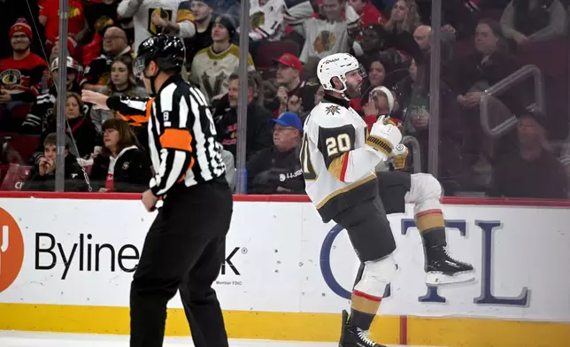 Vegas Golden Knights' Brandon Saad (20) celebrates after scoring during the first period of an NHL hockey game against the Chicago Blackhawks, Sunday, Jan. 4, 2026, in Chicago. (AP Photo/Paul Beaty)